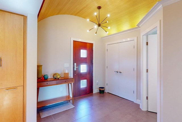 foyer with vaulted ceiling and a chandelier