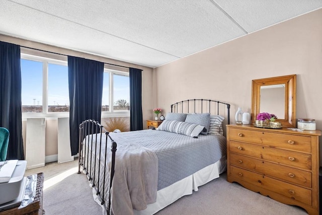 carpeted bedroom with a textured ceiling