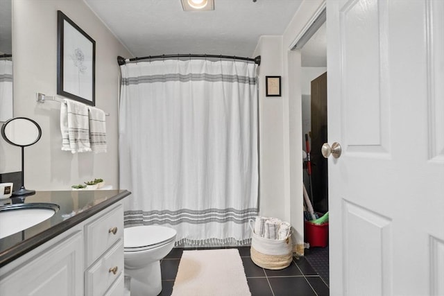 bathroom with tile patterned floors, toilet, a shower with shower curtain, and vanity