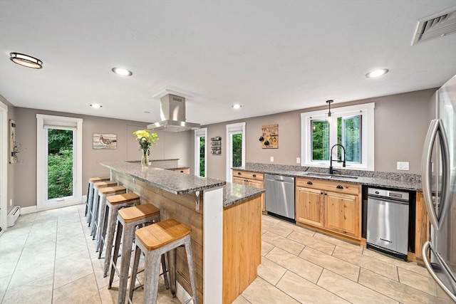 28-R Pammys Path, Easton, MA 02356 - kitchen featuring dishwasher, island exhaust hood, a breakfast bar area, dark stone counters, and light tile patterned flooring