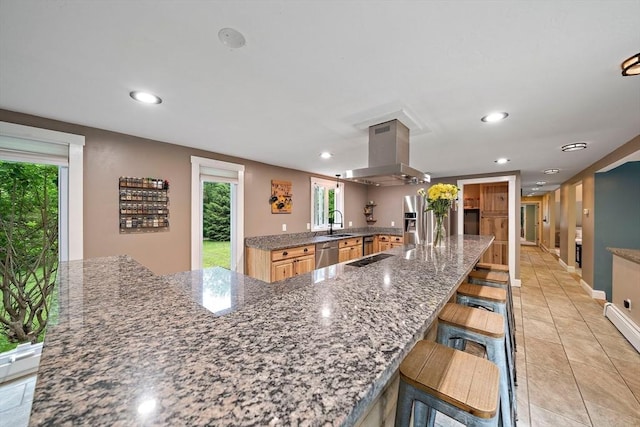 28-R Pammys Path, Easton, MA 02356 - kitchen featuring island exhaust hood, dishwasher, recessed lighting, light tile patterned flooring, and a breakfast bar area