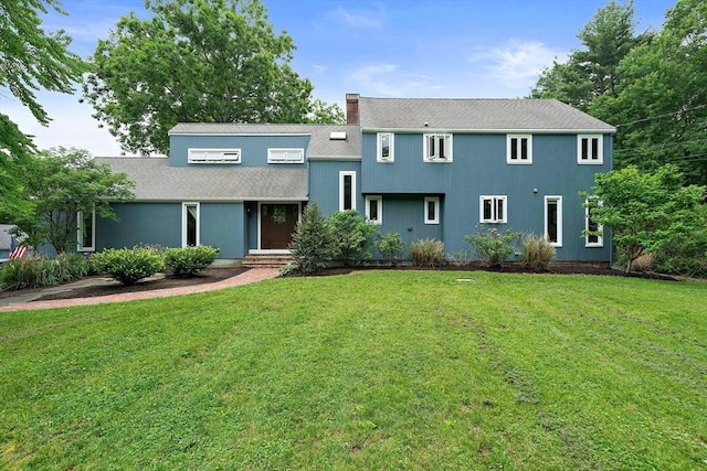 28-R Pammys Path, Easton, MA 02356 - view of front facade with a front yard, roof with shingles, and a chimney