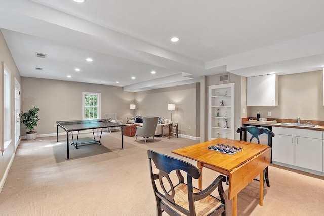 rec room featuring baseboards, recessed lighting, visible vents, and a sink