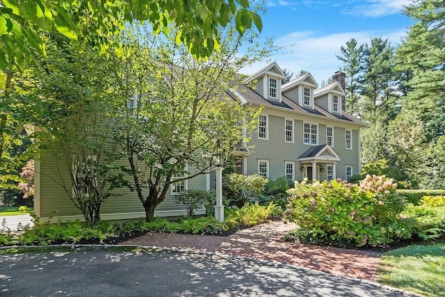 view of front of home featuring a chimney