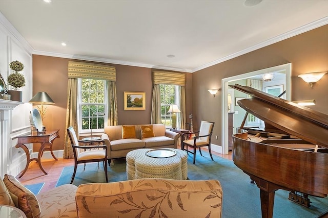 living area with wood finished floors, baseboards, ornamental molding, and a fireplace