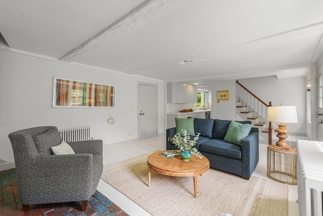 120 Court St, Dedham, MA 02026 - living area featuring stairway and radiator heating unit