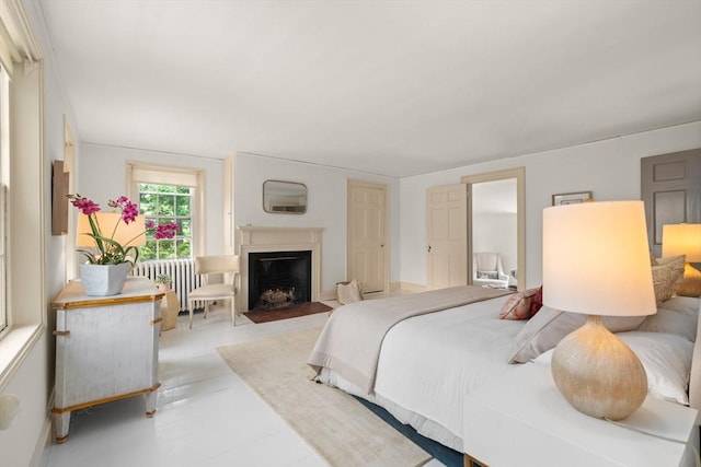 120 Court St, Dedham, MA 02026 - bedroom with radiator heating unit and a fireplace with flush hearth