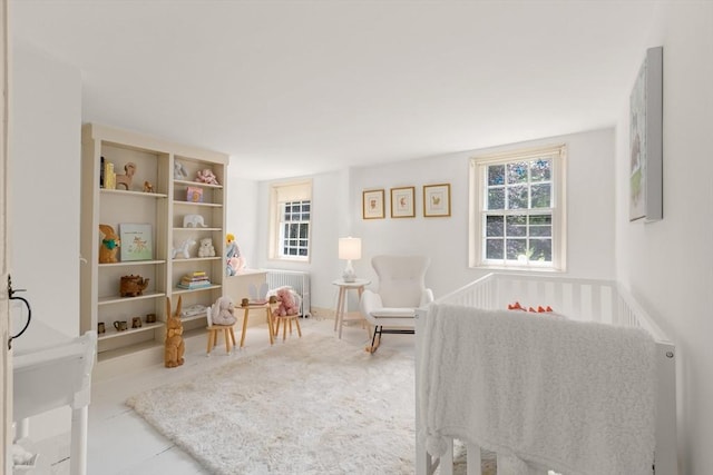 120 Court St, Dedham, MA 02026 - bedroom with multiple windows, radiator, and tile patterned flooring