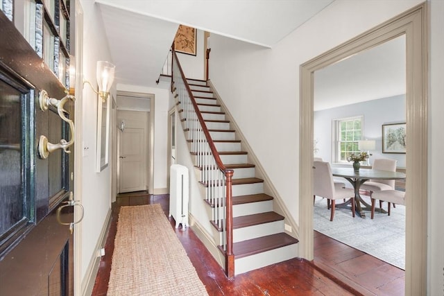 120 Court St, Dedham, MA 02026 - foyer entrance featuring stairway, hardwood / wood-style flooring, and baseboards
