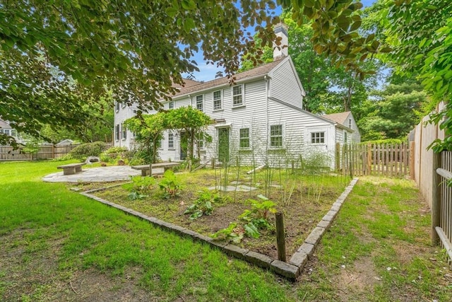 120 Court St, Dedham, MA 02026 - back of property with a chimney and a patio area