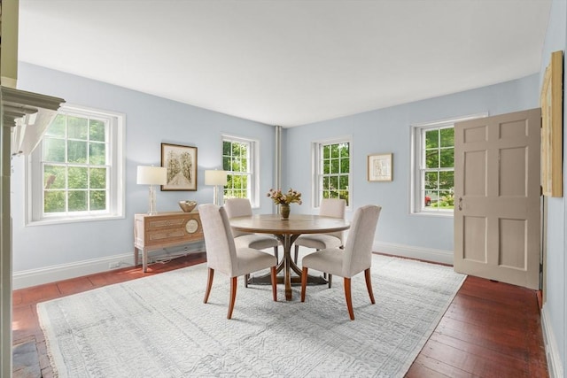 120 Court St, Dedham, MA 02026 - dining space featuring healthy amount of natural light, wood-type flooring, and baseboards