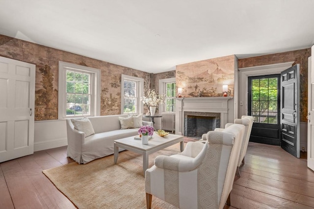 120 Court St, Dedham, MA 02026 - living room featuring hardwood / wood-style floors, a premium fireplace, baseboards, and wallpapered walls