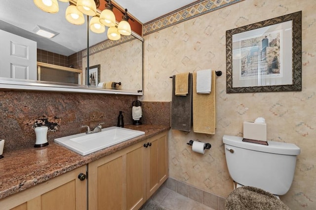 1100 Salem St Unit 103, Lynnfield, MA 01940 - bathroom featuring an enclosed shower, vanity, toilet, backsplash, and tile patterned flooring