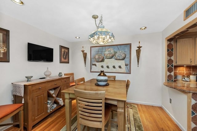 1100 Salem St Unit 103, Lynnfield, MA 01940 - dining space with light wood-style flooring, baseboards, a chandelier, and recessed lighting