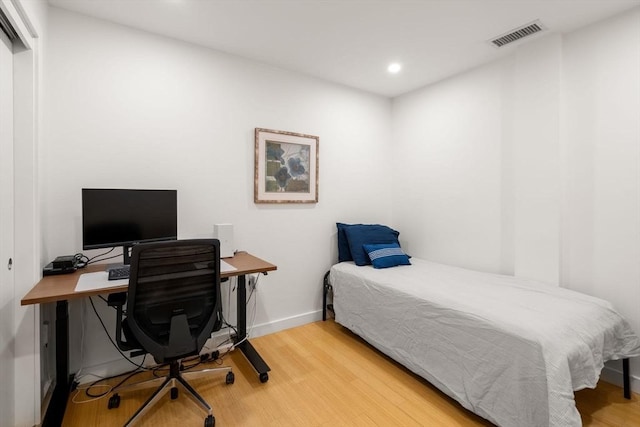 99 Chestnut Hill Ave Unit 212, Boston, MA 02135 - bedroom featuring wood finished floors, recessed lighting, baseboards, and an office area