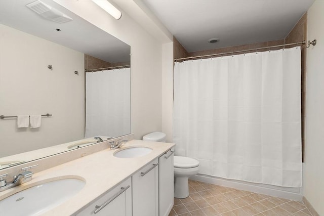 99 Chestnut Hill Ave Unit 212, Boston, MA 02135 - bathroom with double vanity, toilet, tile patterned flooring, and curtained shower