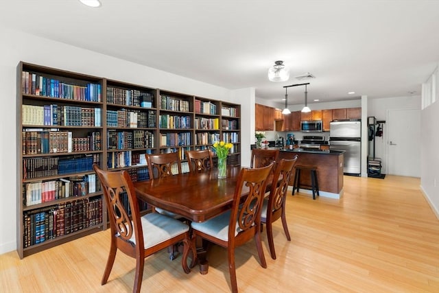 99 Chestnut Hill Ave Unit 212, Boston, MA 02135 - dining area with light wood-style floors, recessed lighting, and baseboards