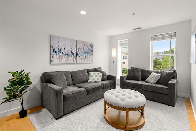99 Chestnut Hill Ave Unit 212, Boston, MA 02135 - living room featuring wood finished floors, baseboards, and recessed lighting