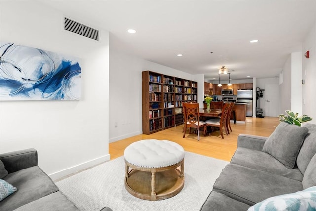 99 Chestnut Hill Ave Unit 212, Boston, MA 02135 - living area with recessed lighting, light wood finished floors, and baseboards