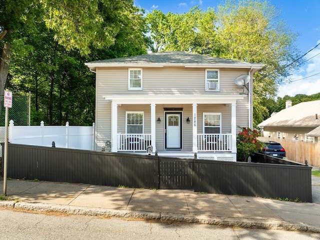 1286 Locust St, Fall River, MA 02723 - traditional-style home with a porch and a fenced front yard