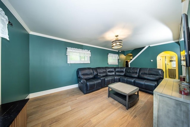 1286 Locust St, Fall River, MA 02723 - living room with arched walkways, light wood-type flooring, crown molding, and baseboards