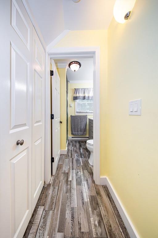 1286 Locust St, Fall River, MA 02723 - hallway with dark wood finished floors and baseboards