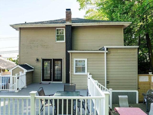 1286 Locust St, Fall River, MA 02723 - rear view of property featuring a deck, a chimney, and outdoor dining space