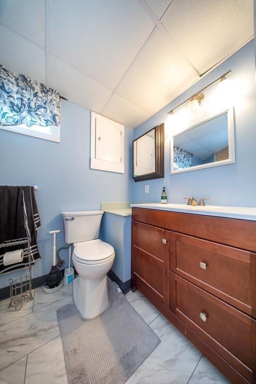 1286 Locust St, Fall River, MA 02723 - bathroom with marble finish floors, toilet, and vanity