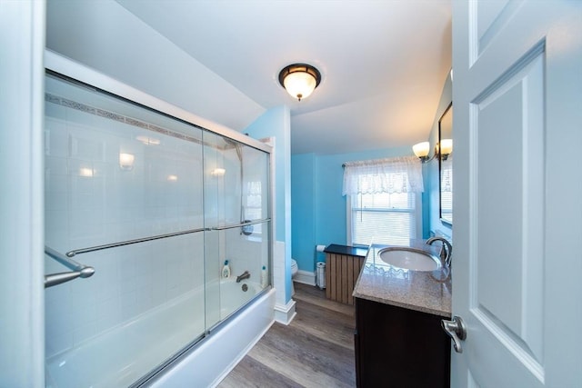 1286 Locust St, Fall River, MA 02723 - bathroom with toilet, vanity, wood finished floors, shower / bath combination with glass door, and baseboards
