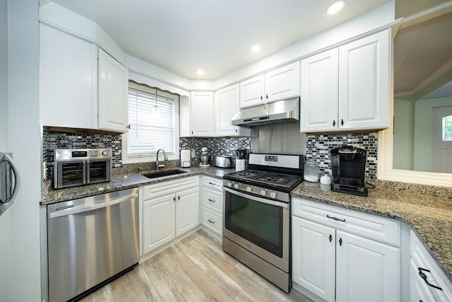 1286 Locust St, Fall River, MA 02723 - kitchen featuring stainless steel appliances, under cabinet range hood, a sink, and healthy amount of natural light