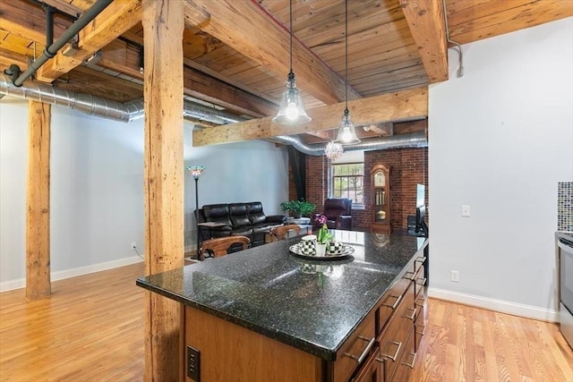 kitchen with baseboards, wooden ceiling, light wood finished floors, hanging light fixtures, and beamed ceiling