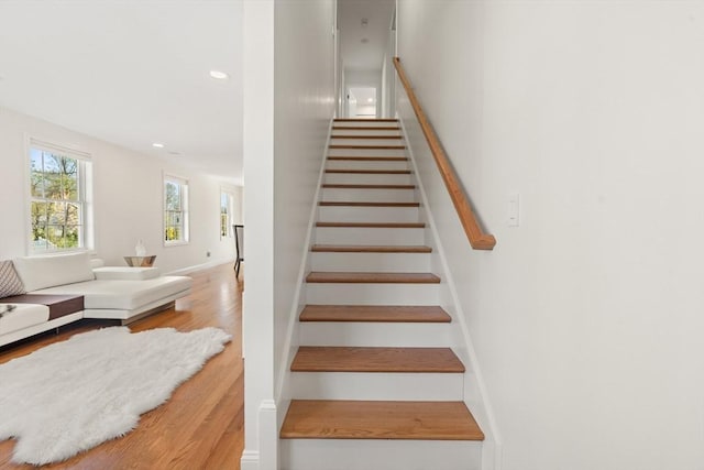 stairs featuring recessed lighting and wood finished floors
