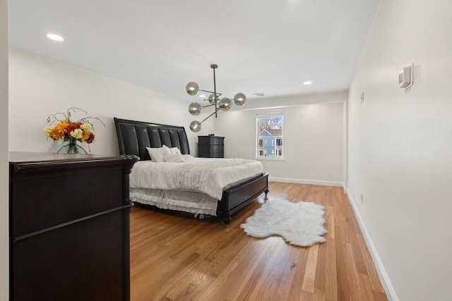 bedroom featuring recessed lighting, baseboards, and light wood-style flooring