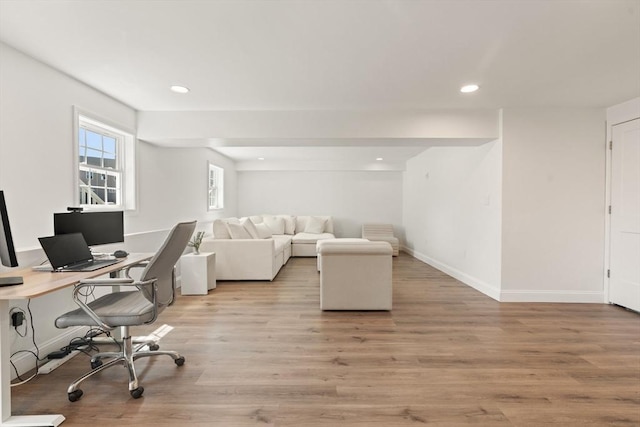 home office featuring baseboards, recessed lighting, and light wood-style flooring