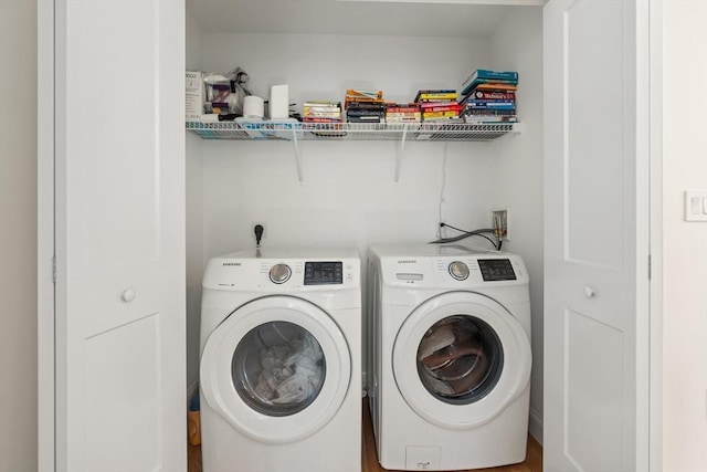 washroom with laundry area and washing machine and dryer