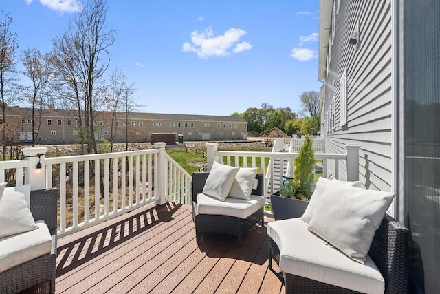 deck featuring outdoor lounge area