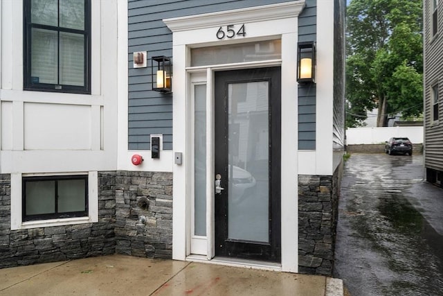 654 E 7th Unit 3, Boston, MA 02127 - doorway to property featuring stone siding