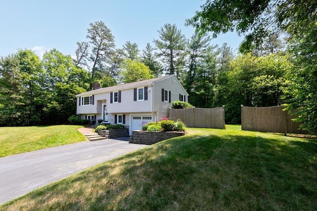 4 Jester Way, Plymouth, MA 02360 - bi-level home with driveway, a garage, and a chimney
