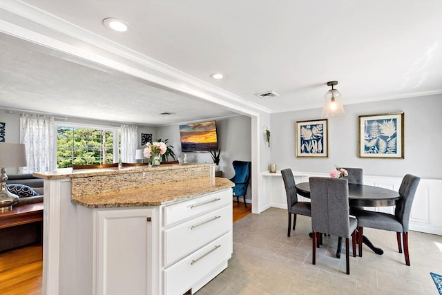 4 Jester Way, Plymouth, MA 02360 - kitchen with open floor plan, light stone countertops, white cabinets, ornamental molding, and recessed lighting
