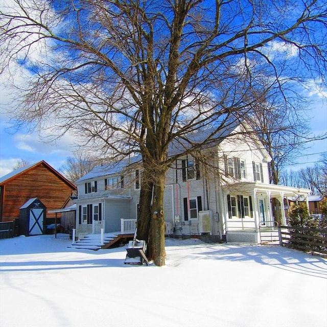 view of front of home with a storage unit