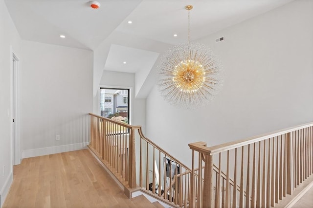 48 Sherburne Rd, Lexington, MA 02421 - corridor with a chandelier, an upstairs landing, wood finished floors, recessed lighting, and baseboards
