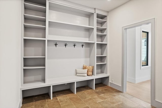 48 Sherburne Rd, Lexington, MA 02421 - mudroom featuring stone tile flooring and baseboards