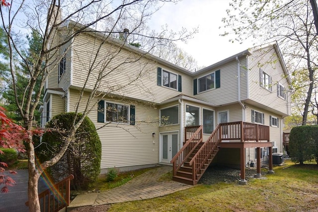 back of house with central AC, a deck, stairway, a chimney, and french doors