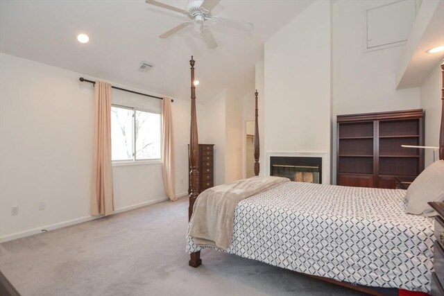 carpeted bedroom with visible vents, recessed lighting, baseboards, and vaulted ceiling