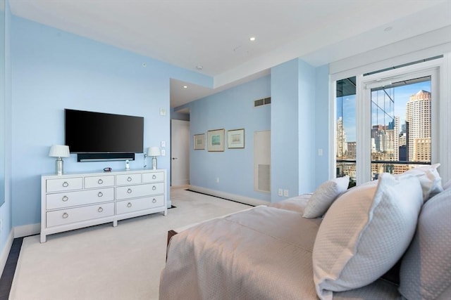 bedroom featuring access to outside, light carpet, baseboards, and recessed lighting