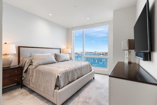 bedroom featuring recessed lighting and expansive windows