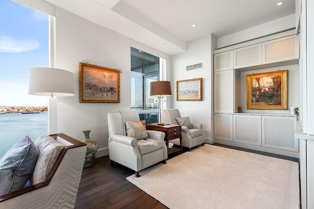 sitting room featuring dark wood-style flooring, recessed lighting, and baseboards
