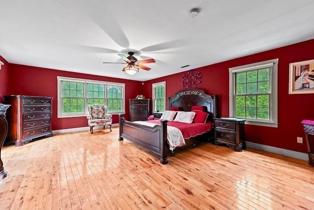 311 River Rd, South Hadley, MA 01075 - bedroom featuring multiple windows, hardwood / wood-style floors, and ceiling fan