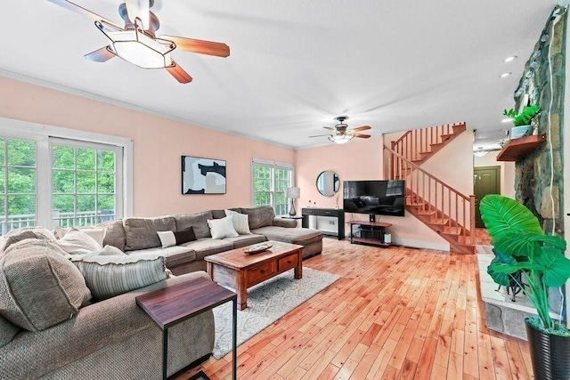 311 River Rd, South Hadley, MA 01075 - living area featuring ceiling fan, stairs, light wood-style floors, and ornamental molding