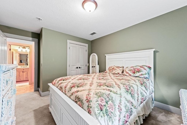 311 River Rd, South Hadley, MA 01075 - bedroom featuring light colored carpet, baseboards, and a closet